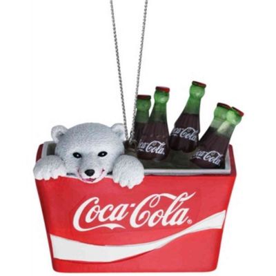 Polar bear cub in coke cooler