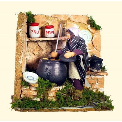 Donna che cucina cm. 8 a mov.